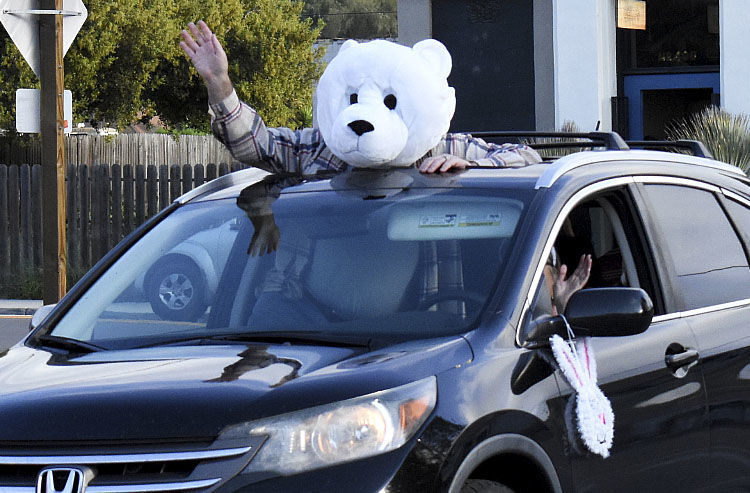 Locals participating in the 3rd Annual cruise Los Alamos parade Saturday evening.